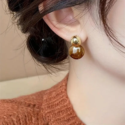Golden Swirl Drop Earrings in Amber Tone