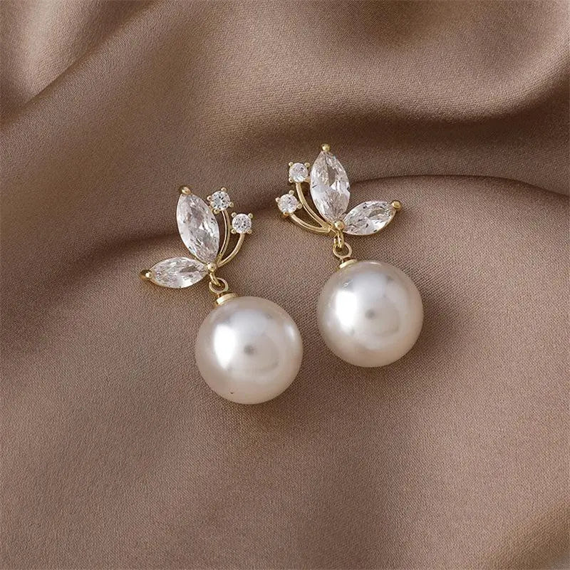 Pearl Drop Earrings with Crystal Leaf Detail in Gold