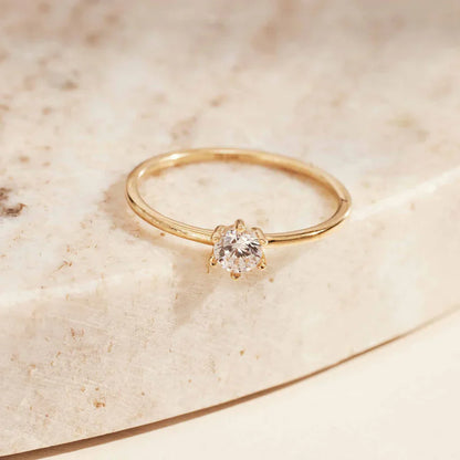 Solitaire Accent Ring in Gold with Sparkling Stone